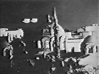 Two luminous heavenly bodies shaped like doves and moving over the church